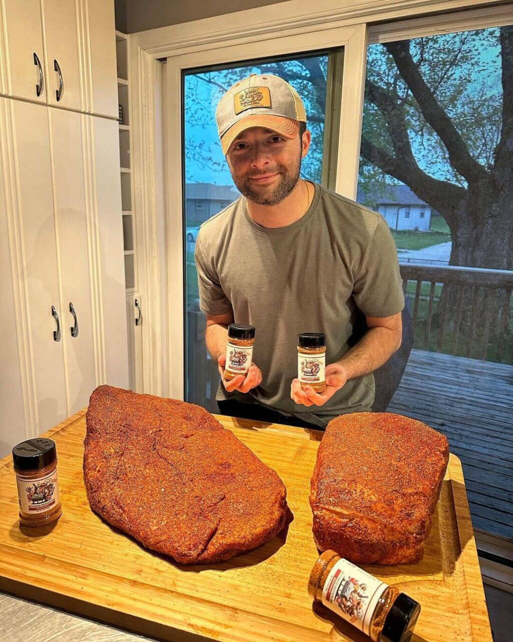 man with barbecue rub and meat