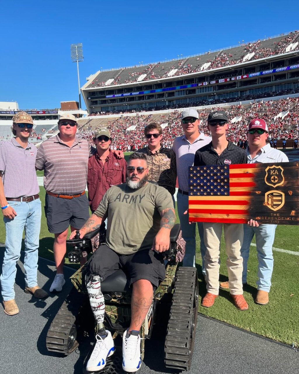 KA members on field with veteran