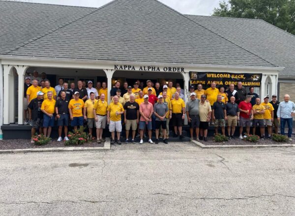 group of men in yellow shirts at KA house