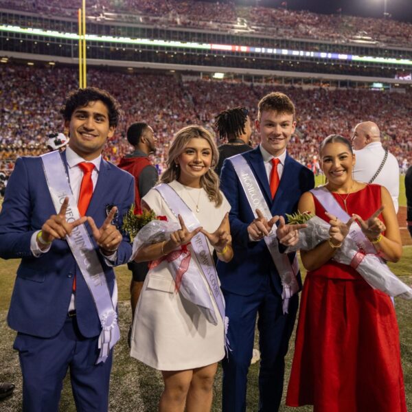 two men and two ladies on homecoming court