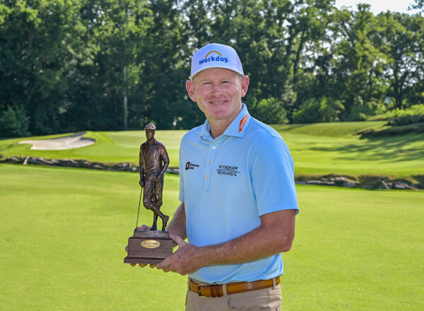 golfer holding trophy