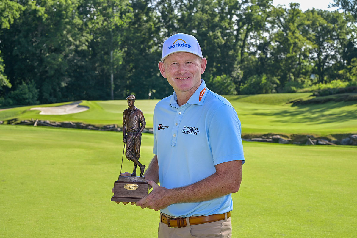 golfer holding trophy