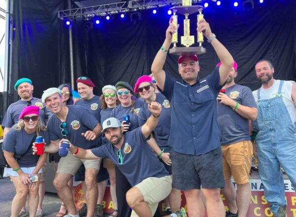 Richard Briseno displays the trophy he won for his barbecue sauce at the World Championship BBQ Cooking Contest in Memphis.