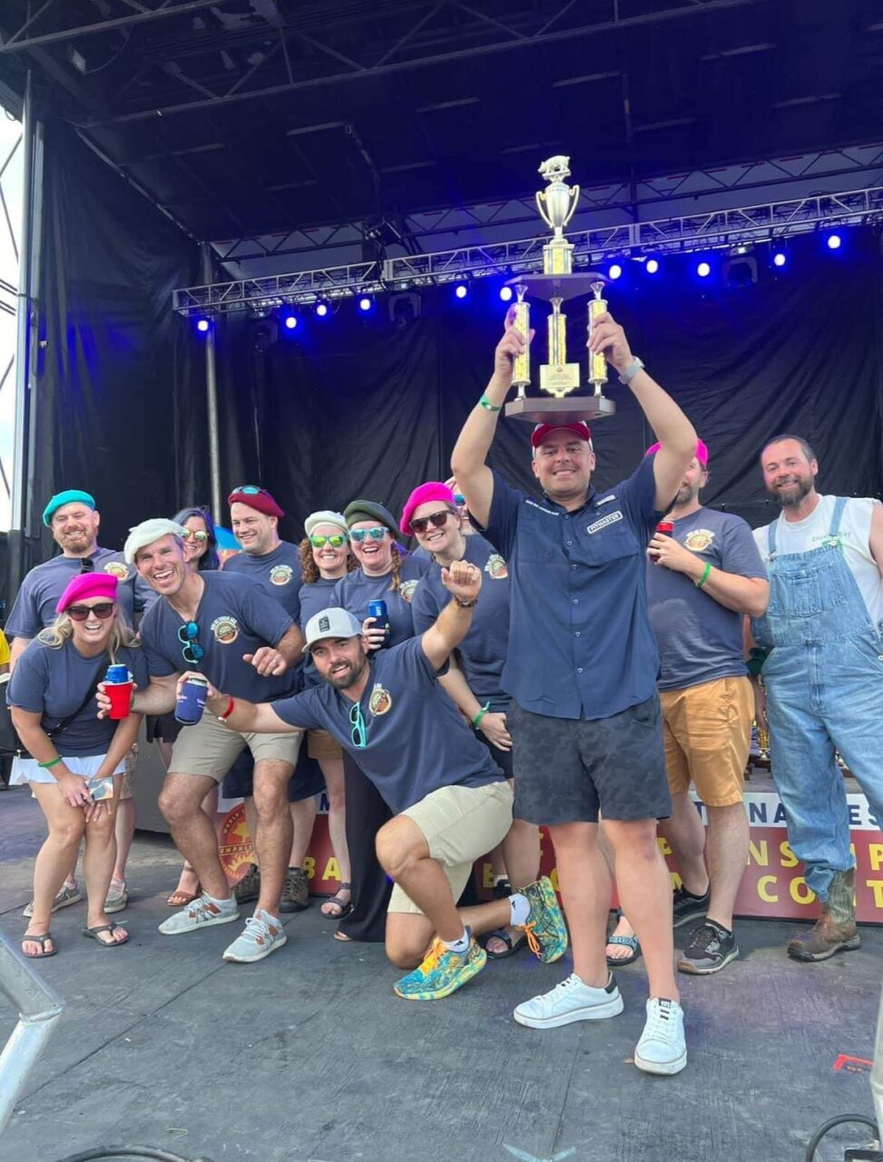 Richard Briseno displays the trophy he won for his barbecue sauce at the World Championship BBQ Cooking Contest in Memphis.