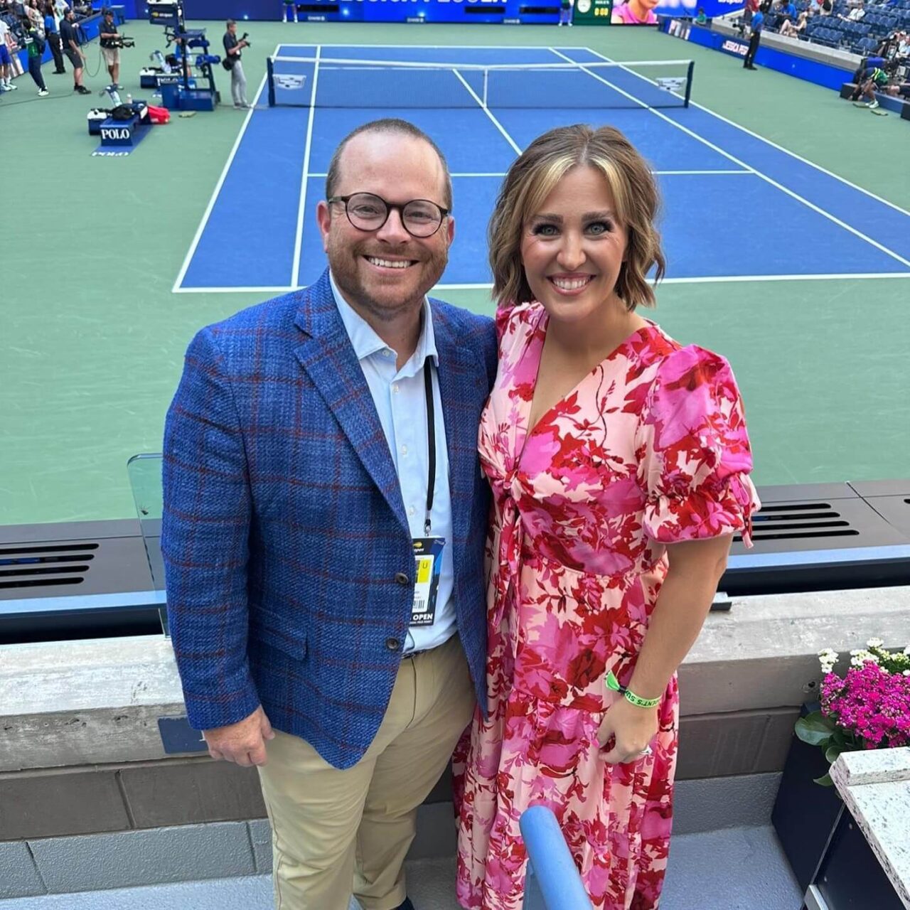 man and woman at tennis match