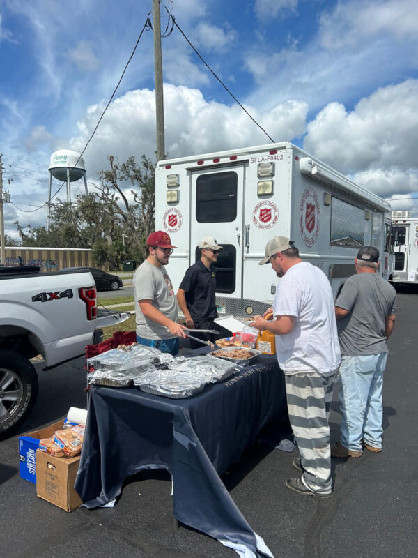 young men with red cross volunteer