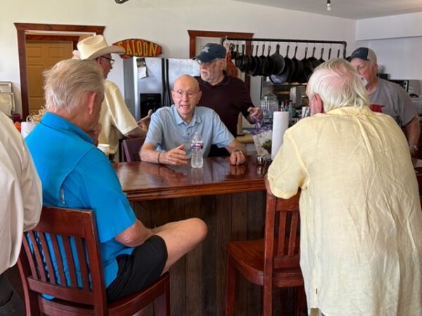 brothers talking around table