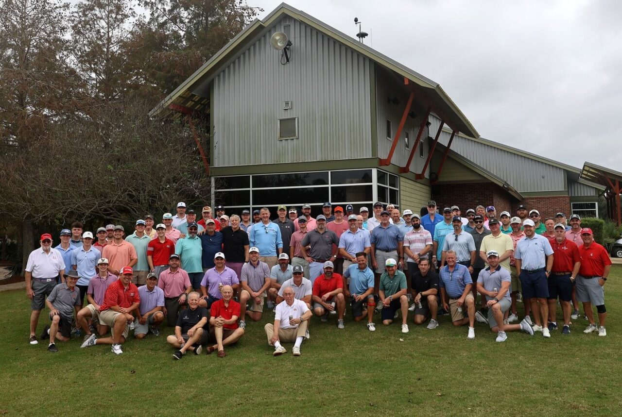 large group photo of men at golf course