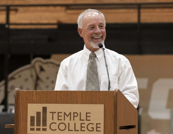 man speaking from a podium the says Temple College