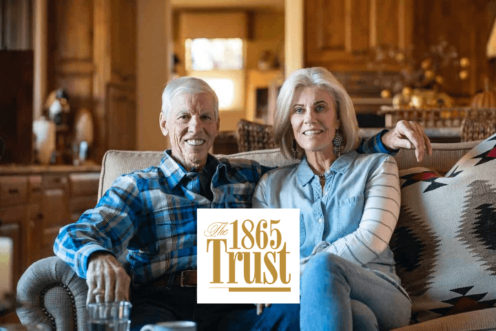 man and wife with 1865 Trust logo